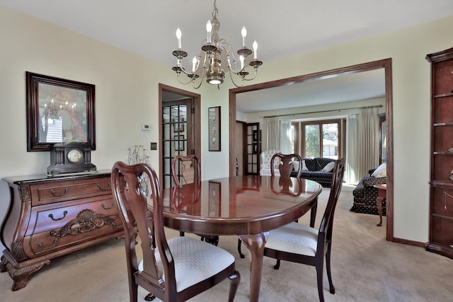 1317 Waterford Rd, Woodbury, MN 55125 - dining room with light colored carpet and a chandelier