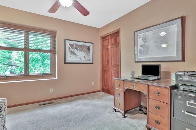 1317 Waterford Rd, Woodbury, MN 55125 - office area featuring ceiling fan, light colored carpet, and baseboards