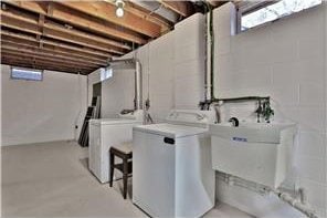 1317 Waterford Rd, Woodbury, MN 55125 - washroom featuring washing machine and clothes dryer
