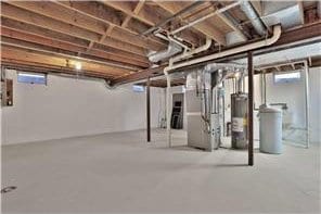 1317 Waterford Rd, Woodbury, MN 55125 - below grade area with water heater and a water softener