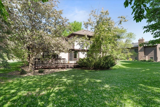 1317 Waterford Rd, Woodbury, MN 55125 - view of grassy yard featuring a deck