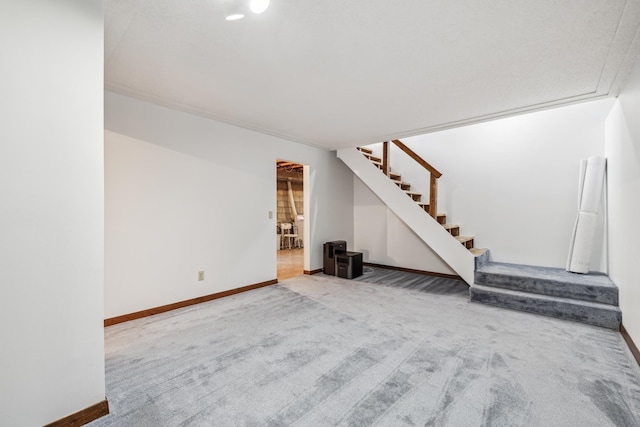93 County 49 NW, Pine River, MN 56474 - unfurnished living room featuring carpet flooring, stairway, baseboards, and recessed lighting