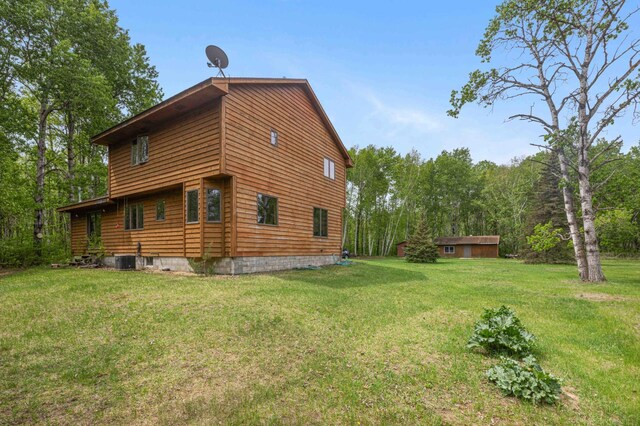 93 County 49 NW, Pine River, MN 56474 - view of property exterior featuring a lawn and cooling unit