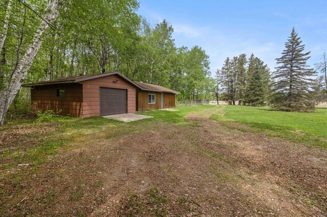 93 County 49 NW, Pine River, MN 56474 - view of yard featuring a garage, driveway, and an outdoor structure