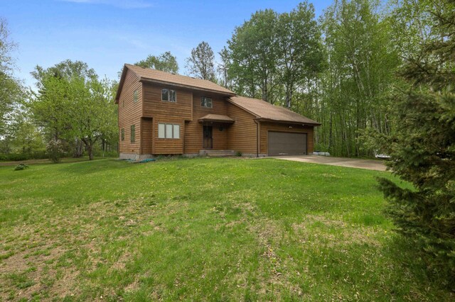 93 County 49 NW, Pine River, MN 56474 - chalet / cabin featuring a garage, driveway, and a front lawn