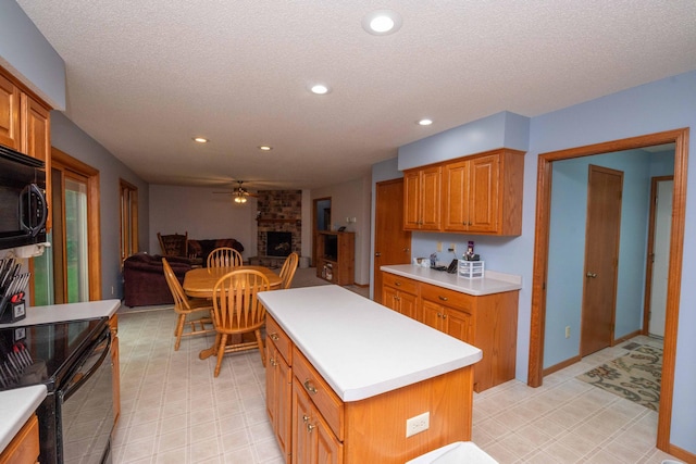 19988 Quentin Ave, Ravenna Twp, MN 55033 - kitchen featuring black appliances, light countertops, light flooring, ceiling fan, and a textured ceiling