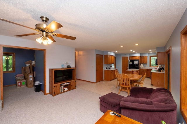 19988 Quentin Ave, Ravenna Twp, MN 55033 - living room with a textured ceiling, a ceiling fan, recessed lighting, baseboards, and healthy amount of natural light