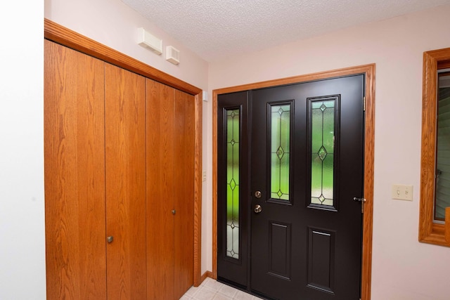 19988 Quentin Ave, Ravenna Twp, MN 55033 - entryway featuring a textured ceiling and baseboards
