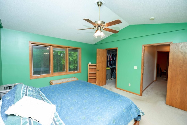 19988 Quentin Ave, Ravenna Twp, MN 55033 - bedroom featuring vaulted ceiling, carpet flooring, a walk in closet, a closet, and ceiling fan