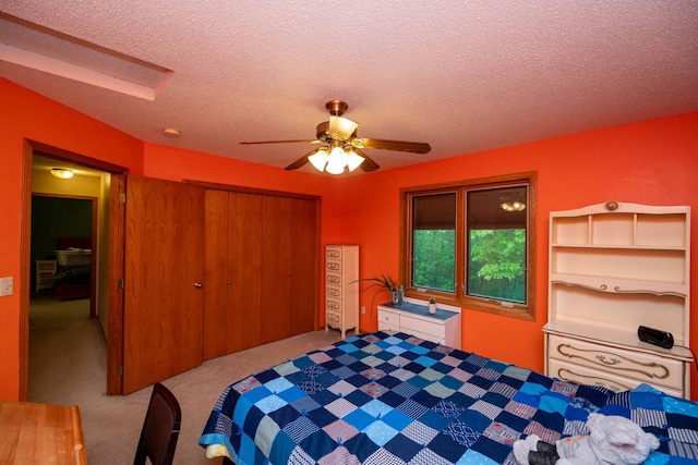 19988 Quentin Ave, Ravenna Twp, MN 55033 - carpeted bedroom with a closet, a textured ceiling, and a ceiling fan