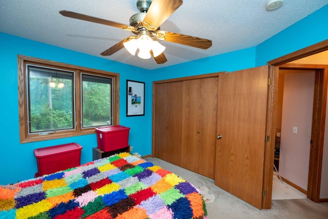 19988 Quentin Ave, Ravenna Twp, MN 55033 - carpeted bedroom with a closet, ceiling fan, and a textured ceiling