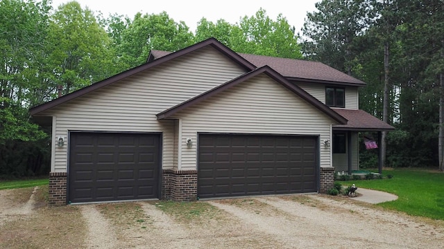 19988 Quentin Ave, Ravenna Twp, MN 55033 - view of front of property with dirt driveway, brick siding, a garage, and roof with shingles