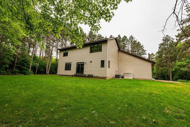 19988 Quentin Ave, Ravenna Twp, MN 55033 - rear view of property featuring a yard and central AC