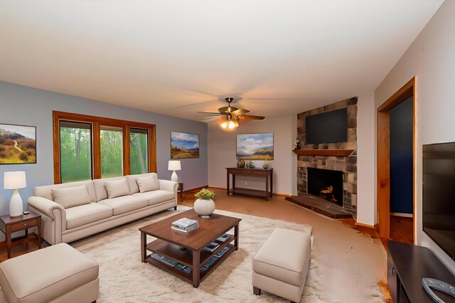 19988 Quentin Ave, Ravenna Twp, MN 55033 - living area with a ceiling fan, a stone fireplace, and carpet flooring