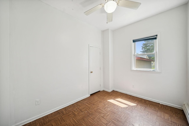 unfurnished room with ceiling fan, baseboards, and a baseboard radiator