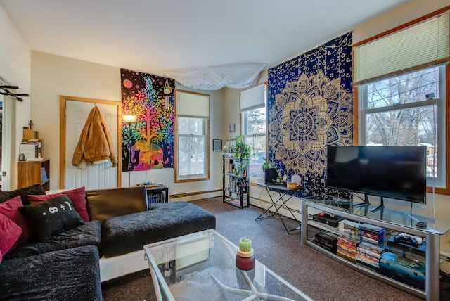 carpeted living room featuring a baseboard heating unit