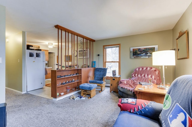 living room featuring a baseboard heating unit, carpet, and baseboards