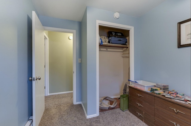 bedroom featuring a closet, carpet flooring, and baseboards