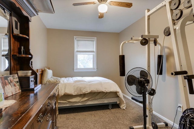 carpeted bedroom with baseboards and ceiling fan