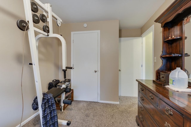 carpeted bedroom featuring baseboards