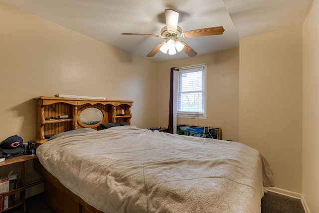 bedroom with baseboards, carpet, a ceiling fan, and baseboard heating