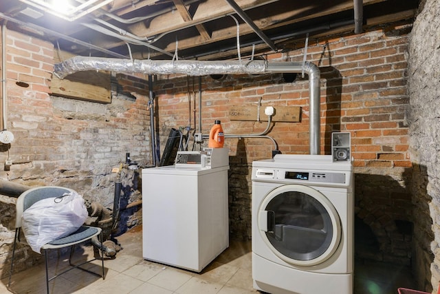 laundry area featuring separate washer and dryer and laundry area