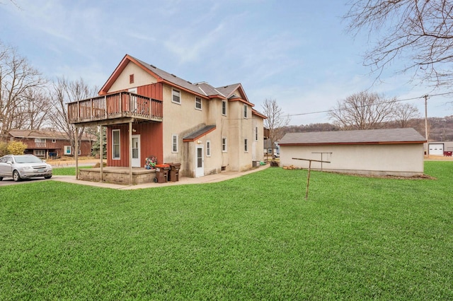back of property featuring a yard and a deck