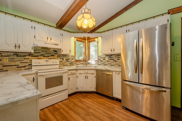 1002 11th Ave W, Alexandria, MN 56308 - kitchen with appliances with stainless steel finishes, under cabinet range hood, dark wood-type flooring, tasteful backsplash, and white cabinets