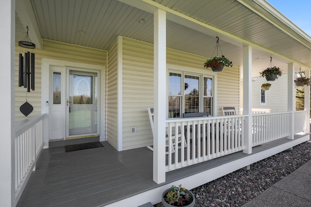 view of exterior entry with covered porch