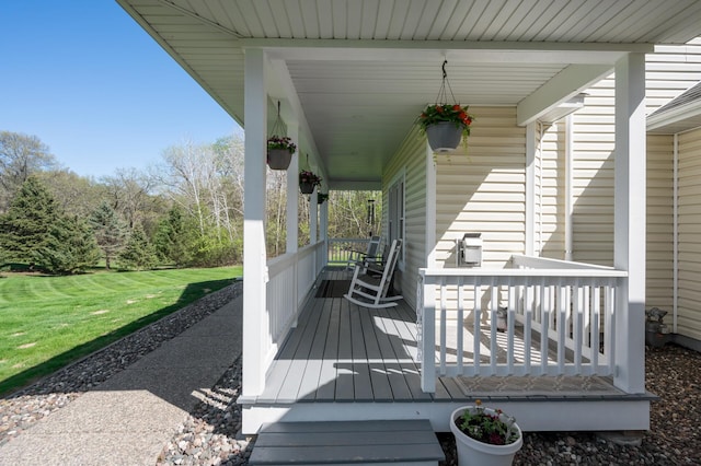 wooden terrace featuring a porch