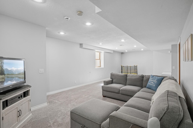 carpeted living room with baseboards and recessed lighting