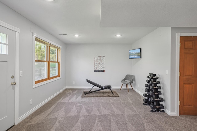 workout room featuring carpet flooring, baseboards, and recessed lighting