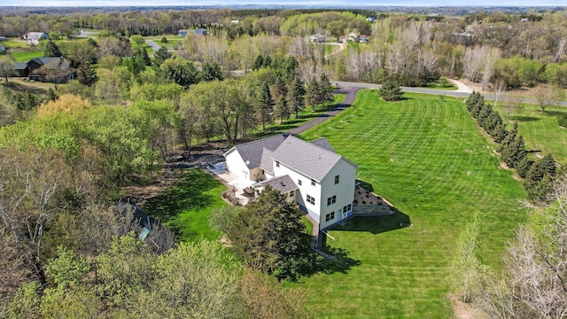 birds eye view of property with a rural view