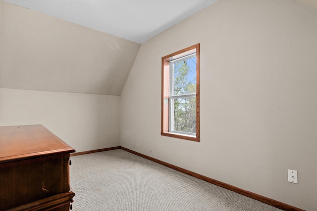 bonus room featuring carpet flooring, baseboards, and lofted ceiling