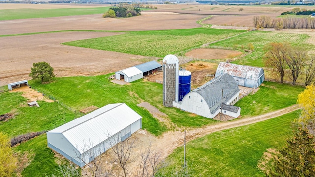 birds eye view of property featuring a rural view