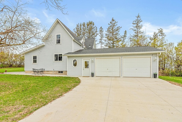 1306 70th Ave, Roberts, WI 54023 - view of side of home with concrete driveway, a garage, and a lawn