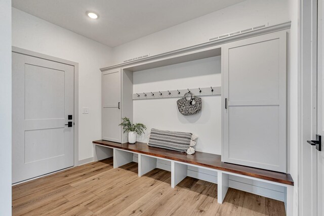 21070 Eagle Dr, Osakis, MN 56360 - mudroom featuring light wood-style floors and recessed lighting