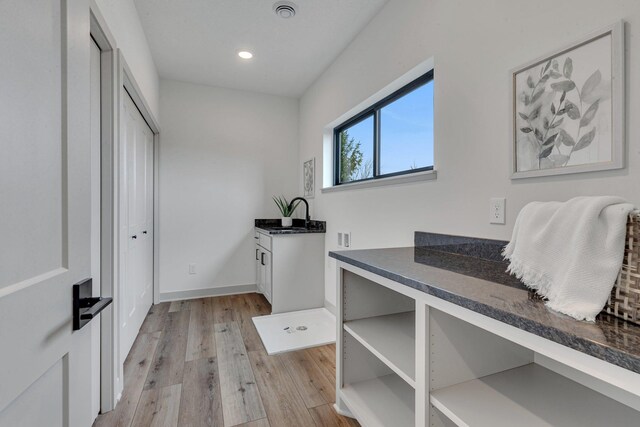 21070 Eagle Dr, Osakis, MN 56360 - washroom featuring light wood-style flooring, cabinet space, recessed lighting, baseboards, and hookup for a washing machine