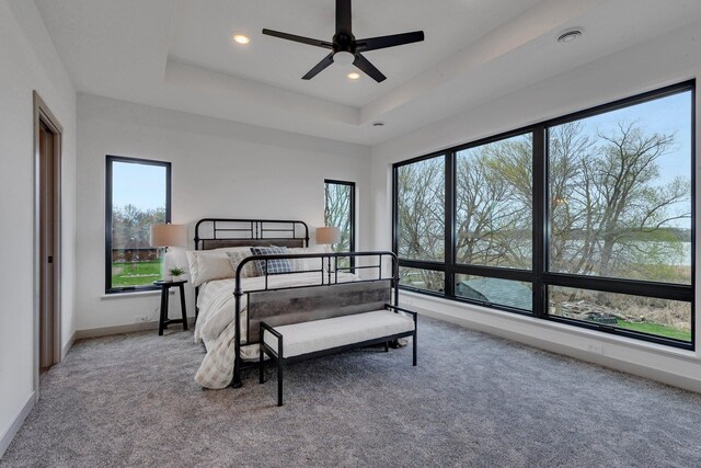 21070 Eagle Dr, Osakis, MN 56360 - carpeted bedroom featuring recessed lighting, a raised ceiling, baseboards, and ceiling fan