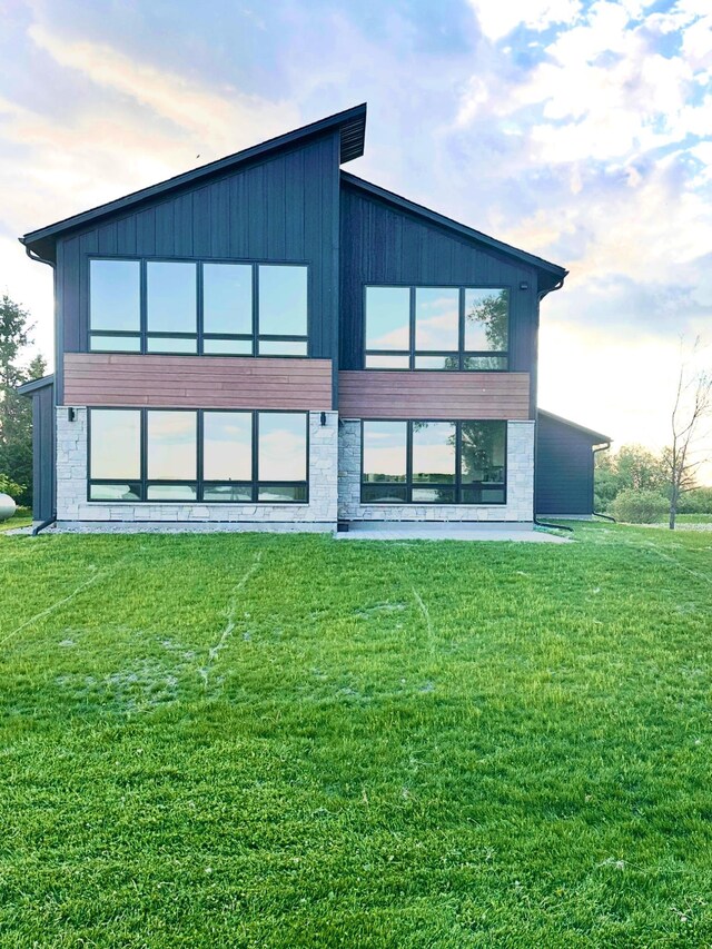 21070 Eagle Dr, Osakis, MN 56360 - rear view of property with a lawn and stone siding