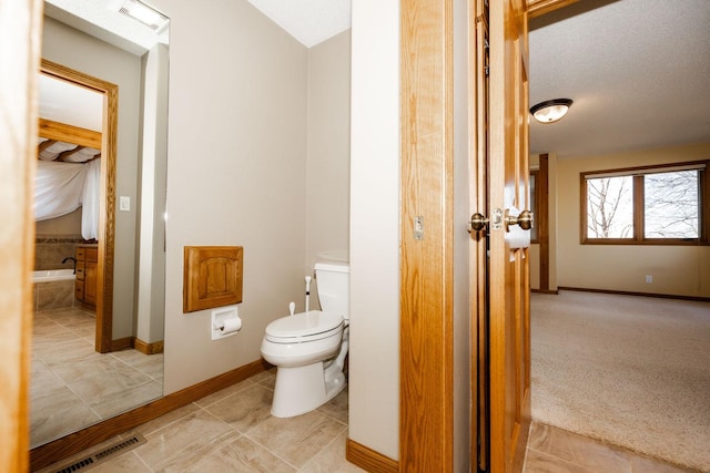 15671 Wermager Beach Rd, Lake Park, MN 56554 - bathroom with toilet, baseboards, and tile patterned floors