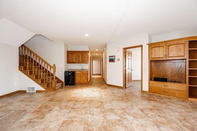 15671 Wermager Beach Rd, Lake Park, MN 56554 - unfurnished living room with a sink, stairs, baseboards, and recessed lighting