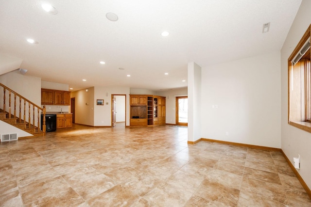 15671 Wermager Beach Rd, Lake Park, MN 56554 - unfurnished living room featuring stairs, baseboards, recessed lighting, and a sink