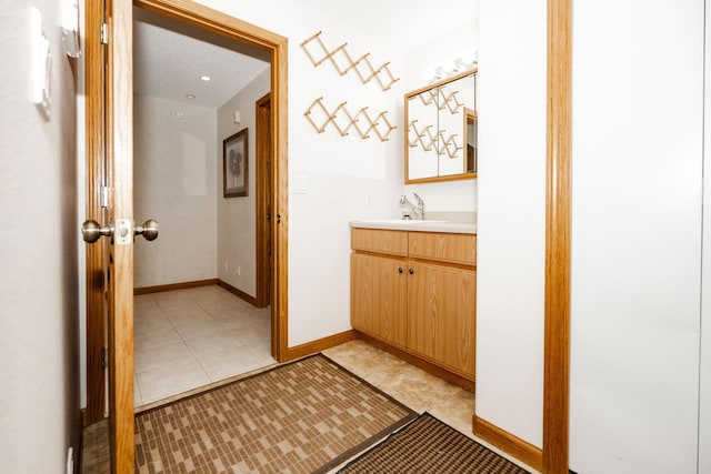 15671 Wermager Beach Rd, Lake Park, MN 56554 - bathroom featuring vanity, baseboards, and tile patterned flooring