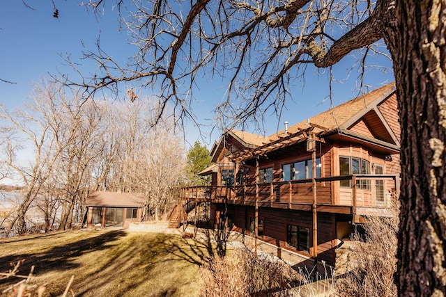 15671 Wermager Beach Rd, Lake Park, MN 56554 - back of house featuring a deck, a lawn, and roof with shingles