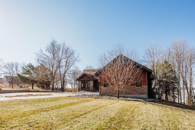 15671 Wermager Beach Rd, Lake Park, MN 56554 - view of front of house with a front lawn and brick siding