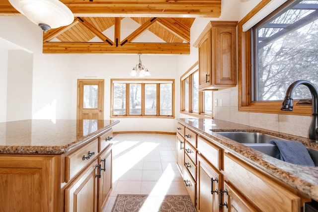 15671 Wermager Beach Rd, Lake Park, MN 56554 - kitchen featuring a sink, plenty of natural light, light stone counters, a chandelier, and wood ceiling