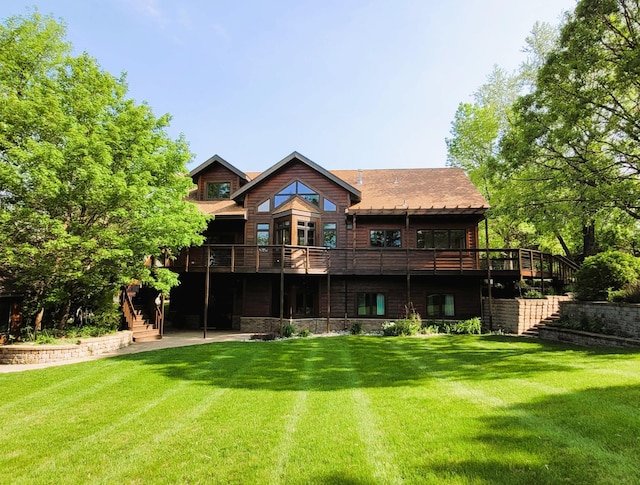 15671 Wermager Beach Rd, Lake Park, MN 56554 - rear view of house featuring stairway, a wooden deck, and a lawn