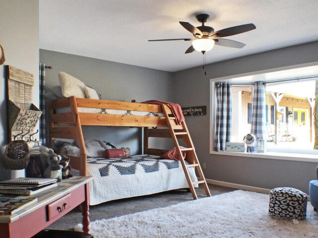 22010 62nd St NW, Colfax Twp, MN 56289 - carpeted bedroom with baseboards and ceiling fan