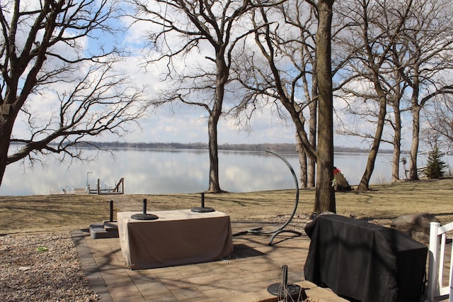 22010 62nd St NW, Colfax Twp, MN 56289 - view of patio with a water view